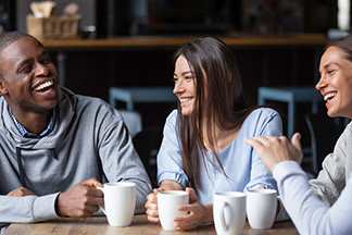 Zelle young adults coffee shop laughing